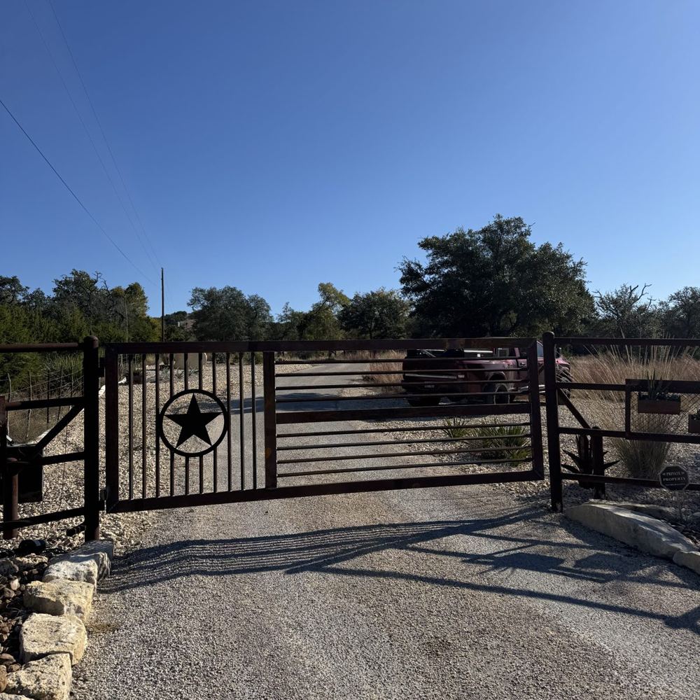 Custom ranch entrance gate with a Texas star