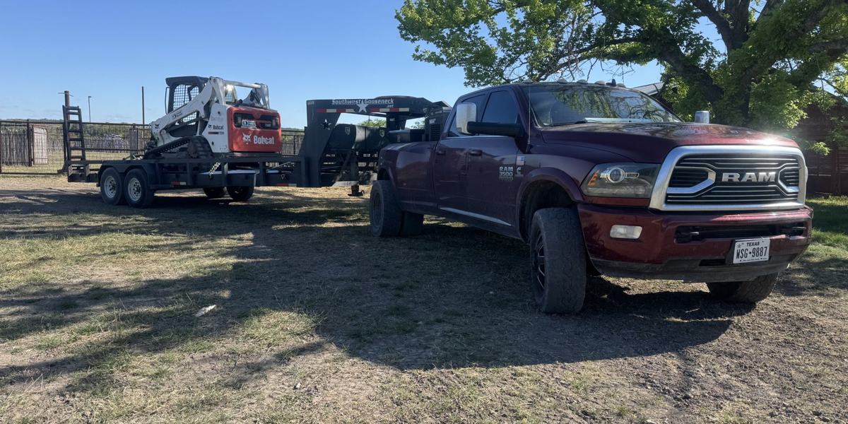 The Ram 3500 with the skid steer on the gooseneck